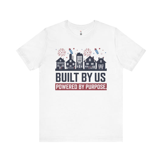 4th of July Unisex T-Shirt – "Built By Us. Powered By Purpose." Patriotic Skyline Design